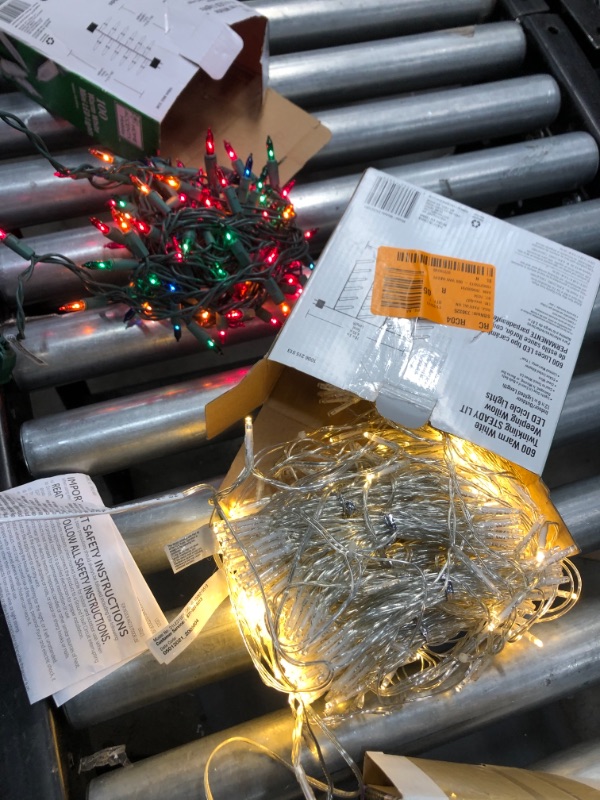 Photo 1 of 12.66 ft. 600-Light Warm White Weeping Willow LED Steady Lit Icicle Lights
and an extra box with different lights. 