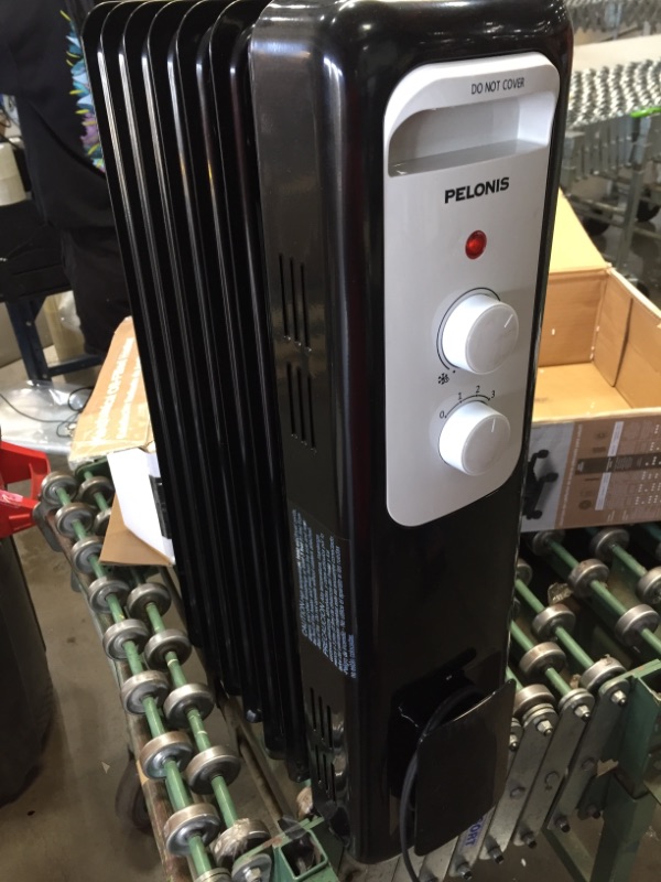 Photo 2 of Pelonis 1,500-Watt Oil-Filled Radiant Electric Space Heater with Thermostat, Black

//TESTED AND TURNS ON BUT DOES NOT FUNCTION 
