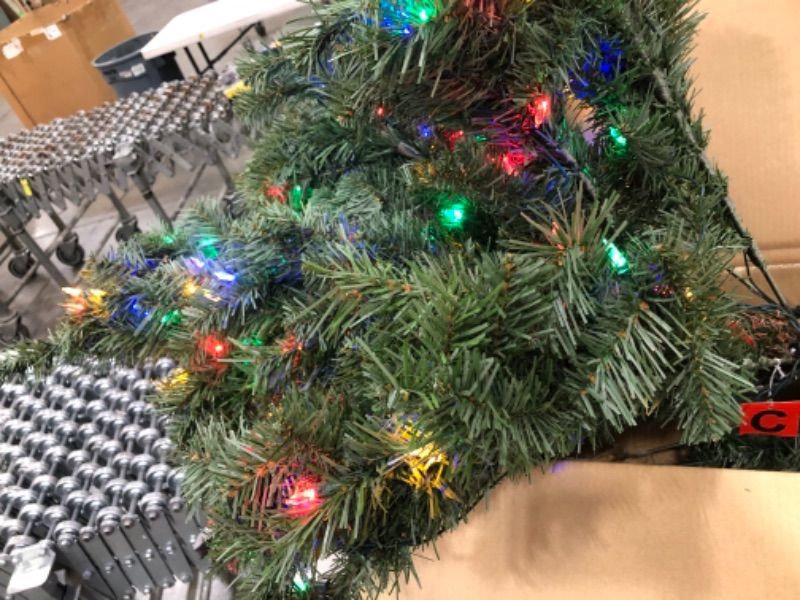 Photo 1 of Home Accents Holiday 7.5 Ft Festive Pine Pre-Lit LED Artificial Christmas Tree with 500 Color Changing Mini Lights

