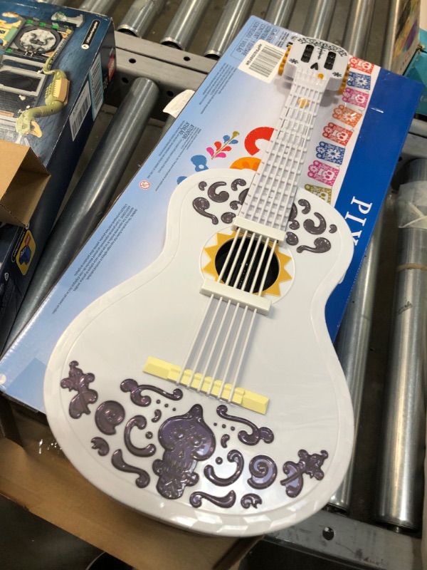 Photo 2 of Disney/Pixar Coco Guitar, Playable Musical Toy with Chord Chart, Approx 25-in (63.5-cm) Long for Kids Ages 3 Years Old & Up [Amazon Exclusive]
