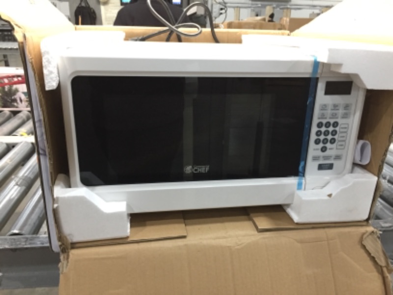 Photo 2 of **DOES NOT TURN ON**
Commercial CHEF 1.1 cu. ft. Countertop Microwave White
