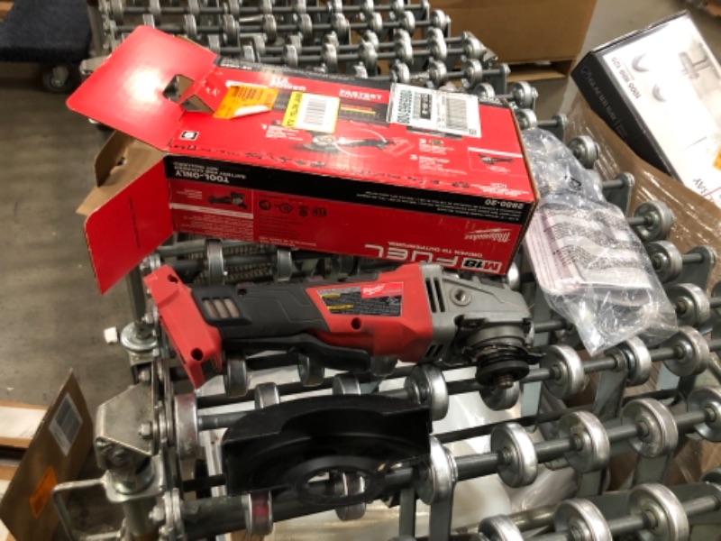 Photo 2 of Milwaukee
M18 FUEL 18-Volt Lithium-Ion Brushless Cordless 4-1/2 in./5 in. Grinder w/Paddle Switch (Tool-Only)