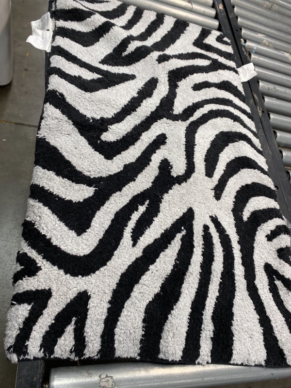 Photo 1 of 40x22 In 2 Piece Zebra Shower Rugs DIRTY 