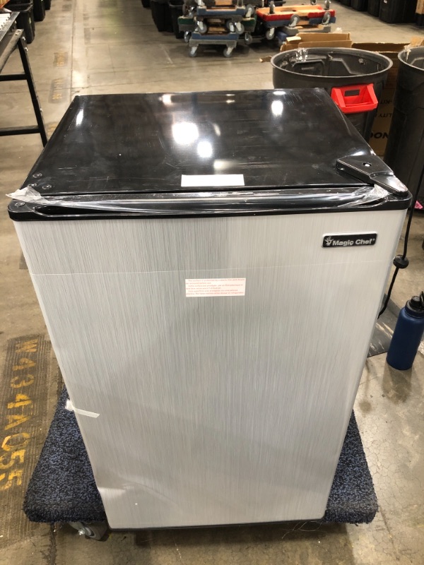 Photo 1 of MAGIC CHEF  3.3 Cu. Ft. Mini Fridge in Stainless Look

//MINOR COSMETIC DAMAGE ON TOP 
