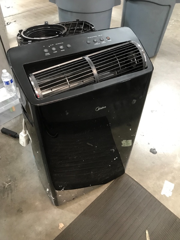 Photo 2 of *front fan is not straight, SEE last picture*
Midea Duo 12,000 BTU(10,000 BTU SACC)Ultra Quiet Smart HE Inverter Portable Air Conditioner, Dehumidifier, and Fan-Cools upto 450 sq.ft, Works with Alexa/Google Assistant Includes Remote Control, Black

