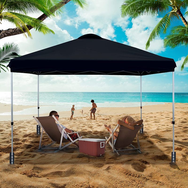 Photo 1 of ASTEROUTDOOR 10'x10' Pop Up Canopy with Adjustable Leg Heights Wheeled Carry Bag, Sandbags, Stakes and Ropes, Black
