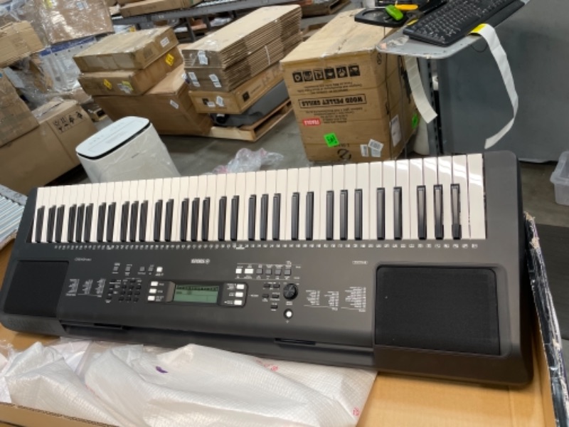 Photo 1 of YAMAHA PSREW310 76 KEY PORTABLE KEYBOARD