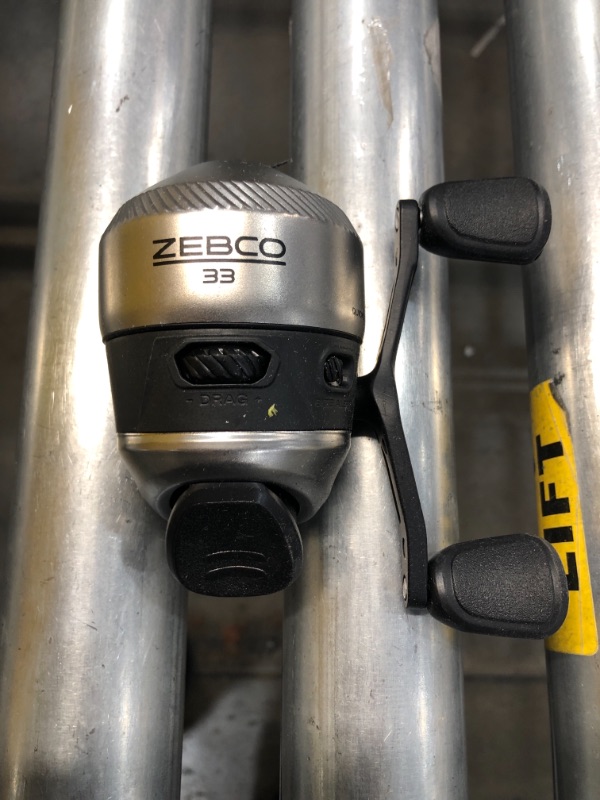 Photo 1 of Zebco 33 Spincast Fishing Reel, Quickset Anti-Reverse with Bite Alert, Smooth Dial-Adjustable Drag, Powerful All-Metal Gears with a Lightweight Graphite Frame