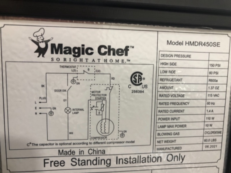 Photo 8 of Magic Chef 4.5 cu. ft. 2 Door Mini Fridge in Stainless Look with Freezer PUNCTURED ON THE FRONT AND CRACKED ON THE DOOR ON THE INSIDE.