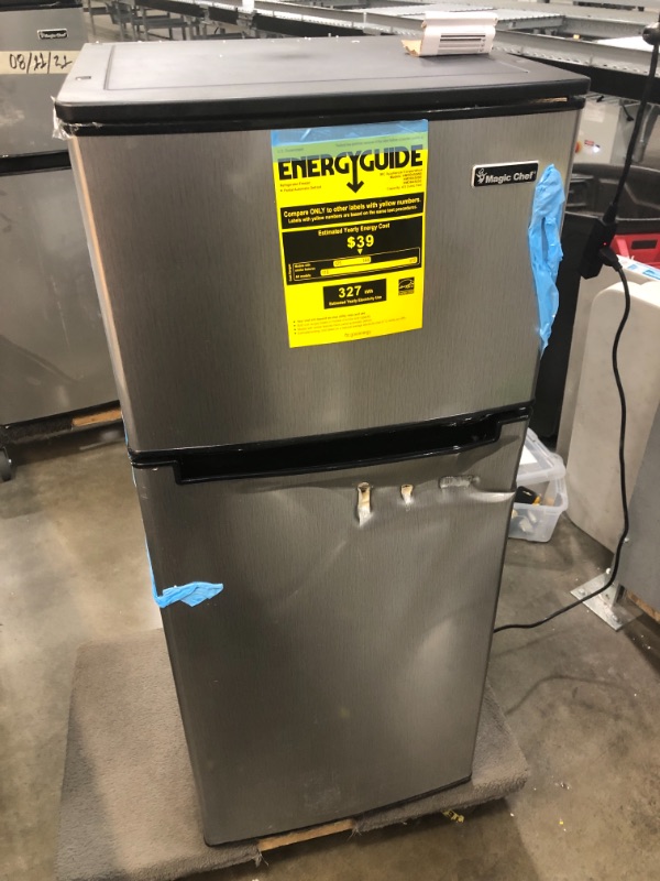 Photo 1 of Magic Chef 4.5 cu. ft. 2 Door Mini Fridge in Stainless Look with Freezer PUNCTURED ON THE FRONT AND CRACKED ON THE DOOR ON THE INSIDE.