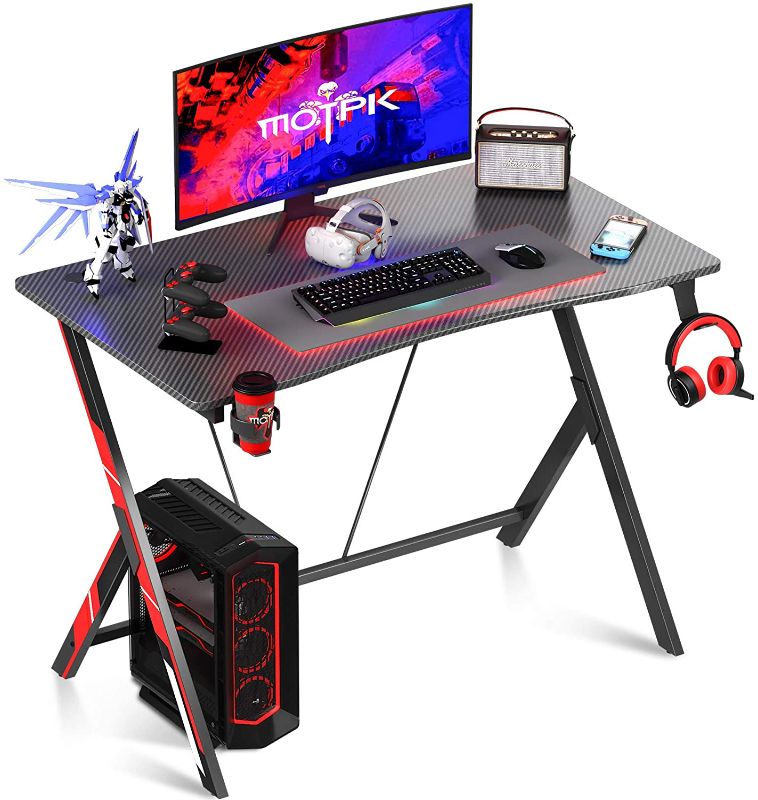 Photo 1 of Motpk Gaming Desk 31 inch PC Computer Desk, Home Office Desk Workstation with Carbon Fiber Surface, Gaming Table with Headphone Hook and Cup Holder
