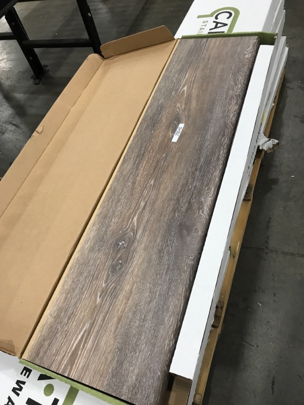 Photo 1 of (pallet of 11) Walton Oak 47 in. L x 12-1/8 in. D x 2-3/16 in. H Vinyl Overlay to Cover Stairs 1-1/8 in. T to 1-3/4 in. T 
