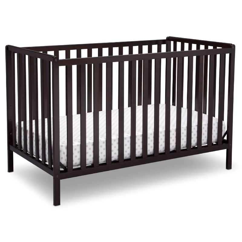 Photo 1 of Delta Children Heartland 4-in-1 Convertible Crib, Dark Chocolate + Delta Children Twinkle Galaxy Dual Sided Recycled Fiber Core Crib and Toddler Mattress (Bundle)
