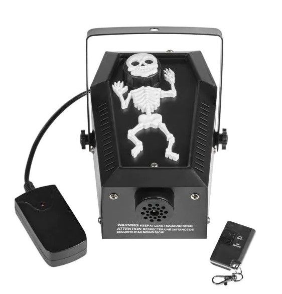 Photo 1 of Home Accents Holiday 4.8 in. 400-Watt Coffin Skeleton Fog Machine

//MISSING REMOTE, DIRTY FROM PREVIOUS USE 
