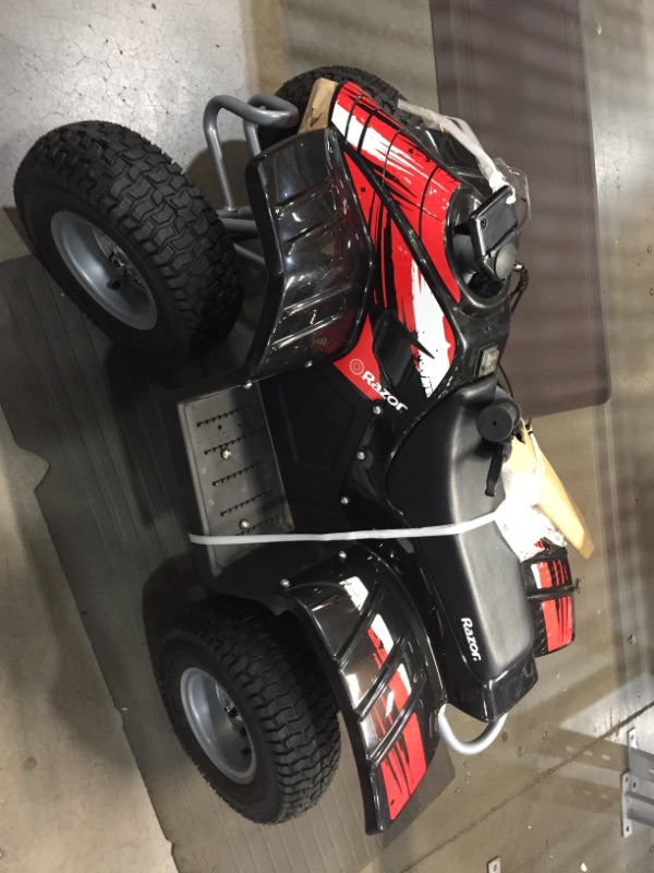 Photo 6 of Razor Dirt Quad - 24V Electric 4-Wheeler ATV - Twist-Grip Variable-Speed Acceleration Control, Hand-Operated Disc Brake, 12" Knobby Air-Filled Tires
