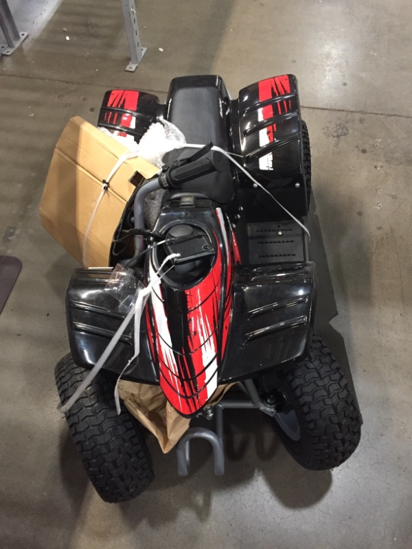 Photo 4 of Razor Dirt Quad - 24V Electric 4-Wheeler ATV - Twist-Grip Variable-Speed Acceleration Control, Hand-Operated Disc Brake, 12" Knobby Air-Filled Tires
