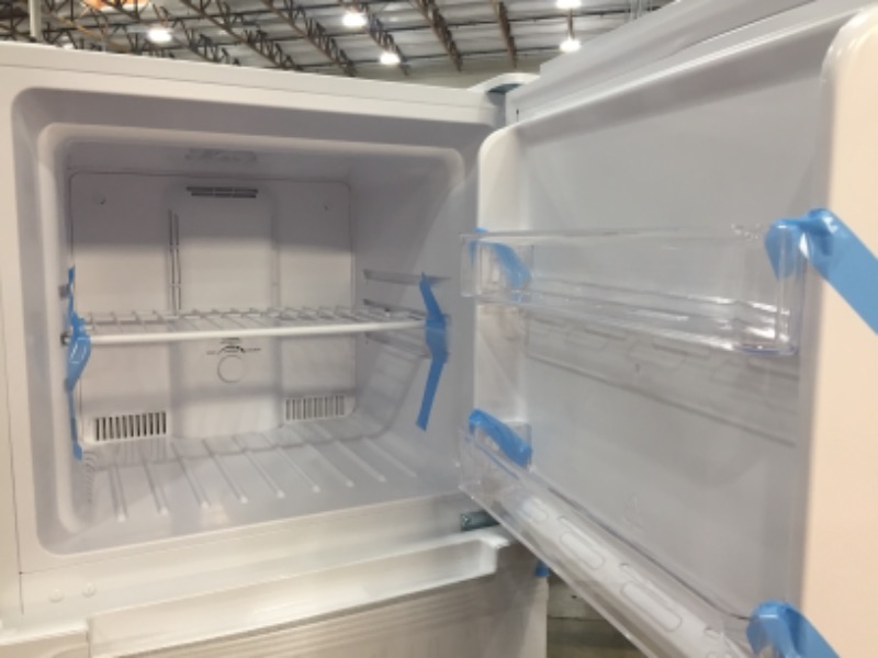 Photo 6 of *Damage shown in pictures*
Magic Chef 10.1 Cu. Ft. Top Freezer Refrigerator in White.
