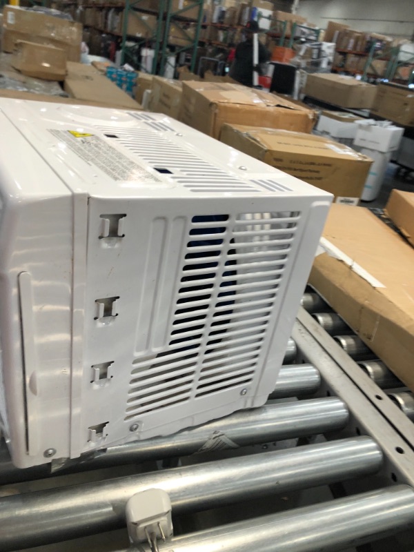 Photo 1 of Amazon Basics Window-Mounted Air Conditioner with Mechanical Control - Cools 150 Square Feet, 5000 BTU, AC Unit
