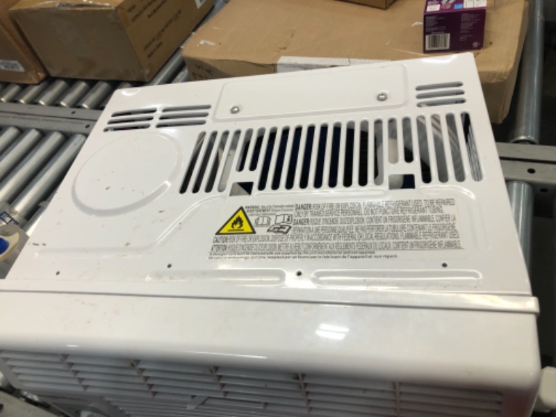 Photo 1 of Amazon Basics Window-Mounted Air Conditioner with Mechanical Control - Cools 150 Square Feet, 5000 BTU, AC Unit
