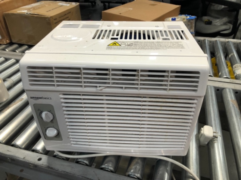 Photo 1 of Amazon Basics Window-Mounted Air Conditioner with Mechanical Control - Cools 150 Square Feet, 5000 BTU, AC Unit
