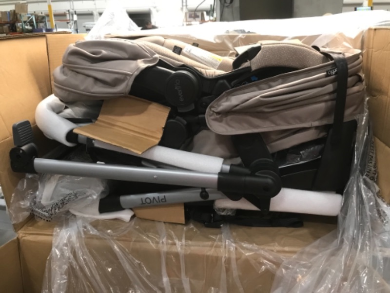 Photo 1 of Evenflo Pivot Modular Travel System with SafeMax Infant Car Seat - Sandstone