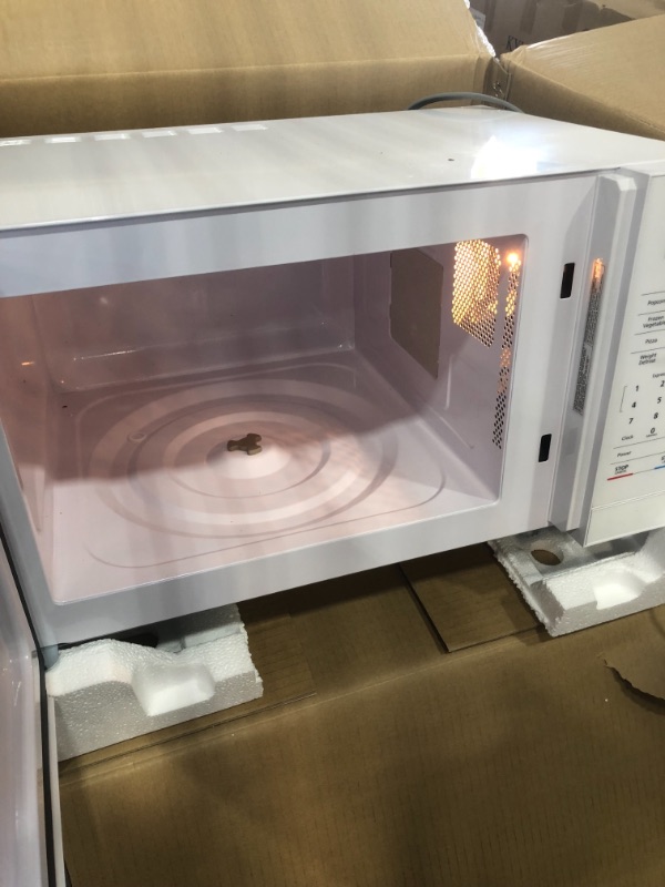 Photo 3 of *SEE last picture for damage*
Magic Chef 1.1 cu. ft. Countertop Microwave in White