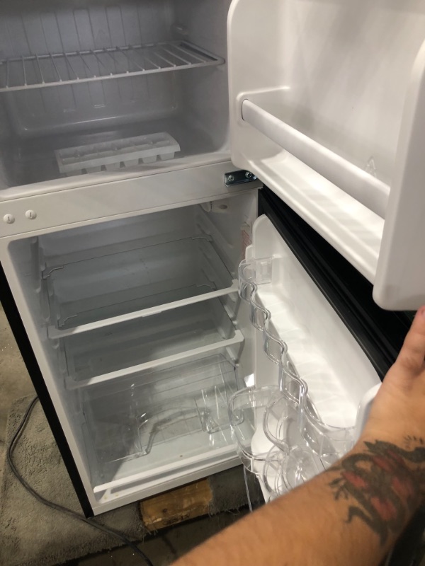 Photo 1 of 4.5 cu. ft. 2 Door Mini Fridge in Stainless Look with Freezer
stinky 
spill inside
