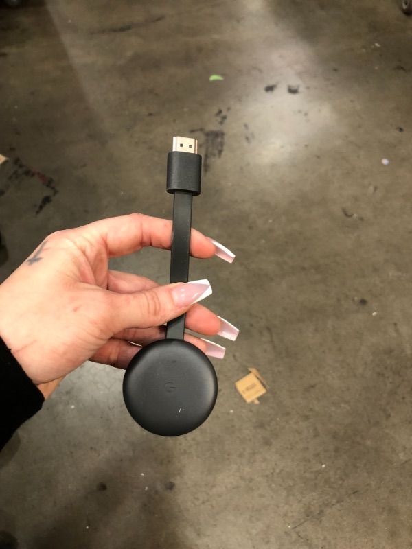 Photo 1 of Google Chromecast - Streaming Device with HDMI Cable - Stream Shows, Music, Photos, and Sports from Your Phone to Your TV
