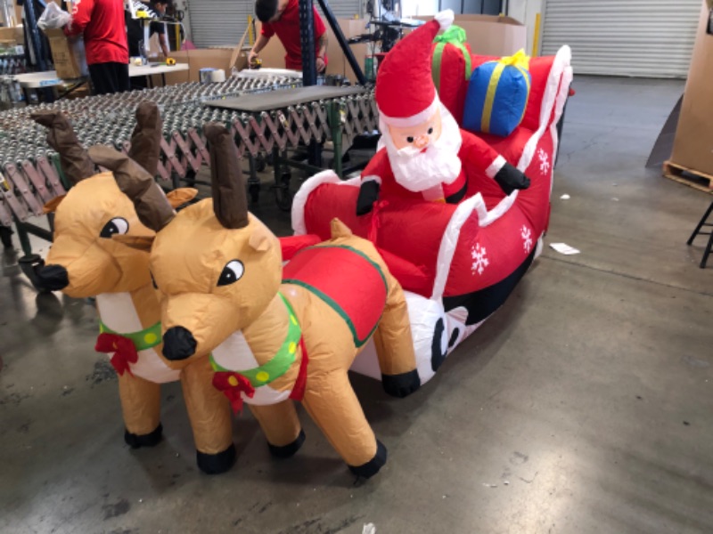 Photo 2 of 8ft. Cute Christmas Inflatable Santa Claus on Sleigh with Two Reindeer
