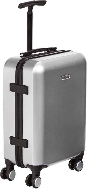 Photo 1 of Amazon Basics Hardshell Spinner Suitcase with Built-In TSA Lock, 22.8-Inch, Silver
