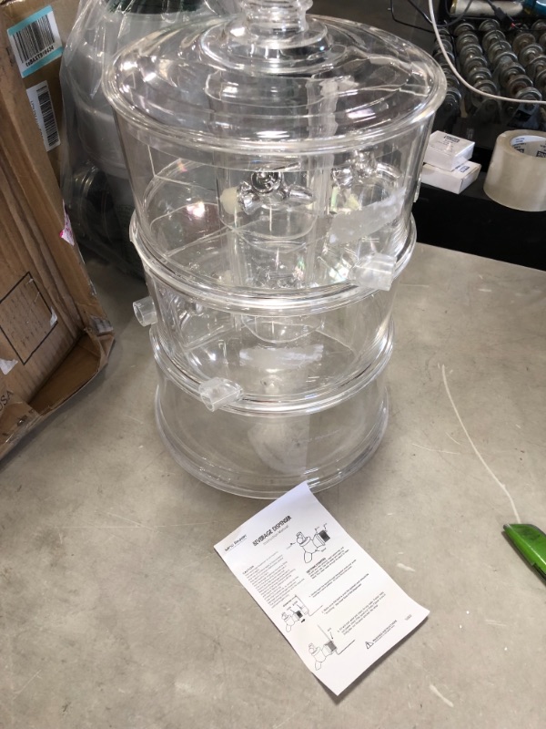 Photo 2 of *SEE last picture for damage*
Mind Reader Beverage Dispenser, 2 Tier Stackable Holder with Lids, Clear Acrylic 4 Compartment Drinks Display with Spigots, One Size
