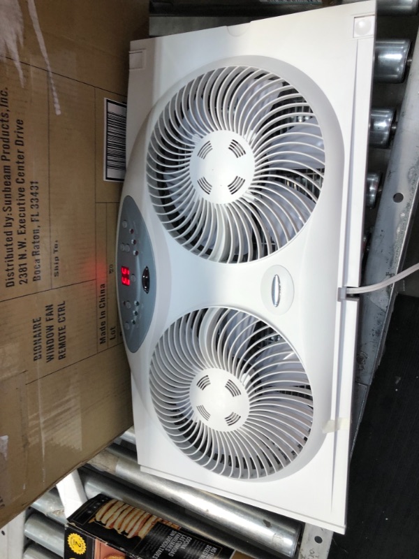 Photo 2 of **USED**
Bionaire Window Fan with Twin 8.5-Inch Reversible Airflow Blades and Remote Control, White
