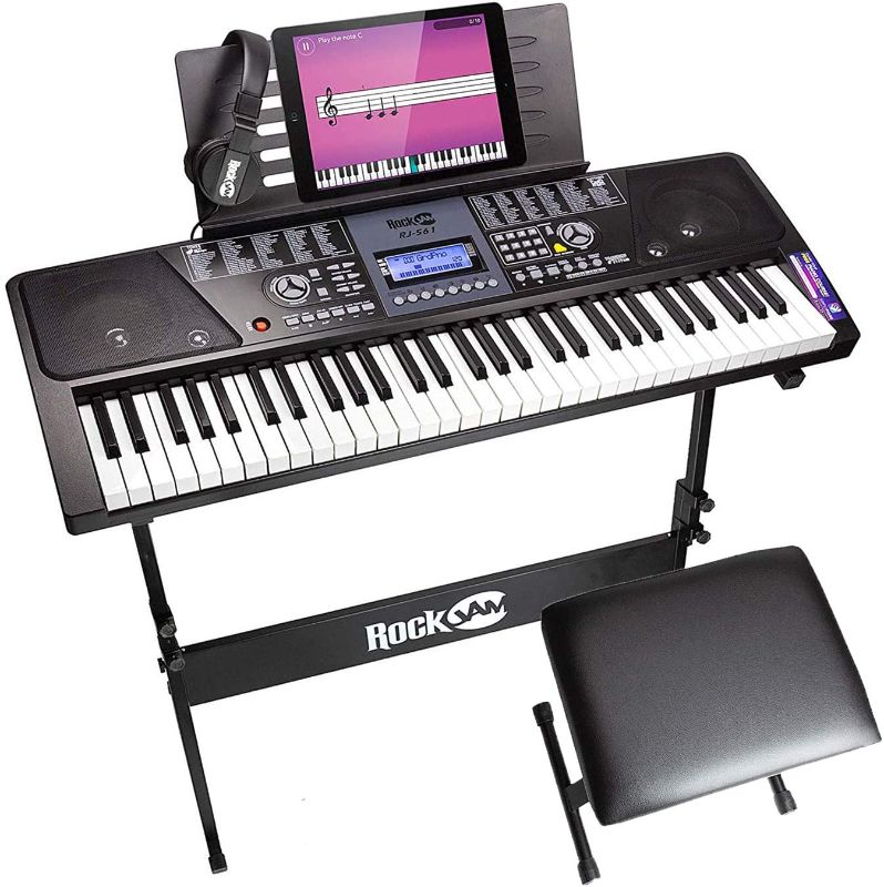 Photo 1 of RockJam 61 Key Keyboard Piano With LCD Display Kit, Keyboard Stand, Piano Bench, Headphones, Simply Piano App & Keynote Stickers 
TESTED AND FUNCTIONS 