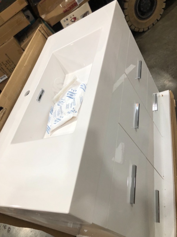 Photo 5 of Alya Bath AT8041W Ripley Collection AT-8041-W 39" Single Sink Bathroom Vanity with 4 Drawers, 1 Door, Pure White Acrylic Countertop, Acrylic Resin Sink, Brushed Chrome Hardware, Medium-Density Fiberboard (MDF) and Wood Veneer Material in White Finish

