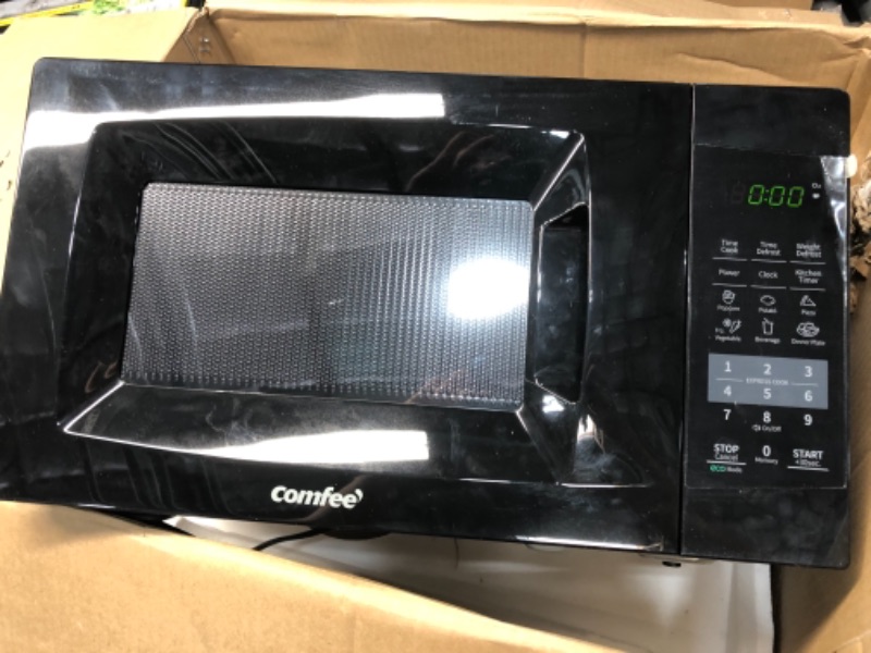 Photo 1 of COMFEE' EM720CPL-PMB Countertop Microwave Oven with Sound On/Off, ECO Mode and Easy One-Touch Buttons, 0.7cu.ft, 700W, Black
PREVIOUSLY OPENED//NONFUCNTIONAL