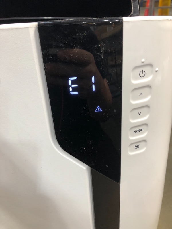 Photo 2 of NOT FUNCTIONAL SEE NOTES
De'Longhi 12000 BTU Portable Air Conditioner, Dehumidifier & Fan + Cool Surround Remote w/Built-in Temperature Control Sensor & Quiet Mode, 500 sq ft, Large Room, Pinguino 6800 BTU (DOE), White