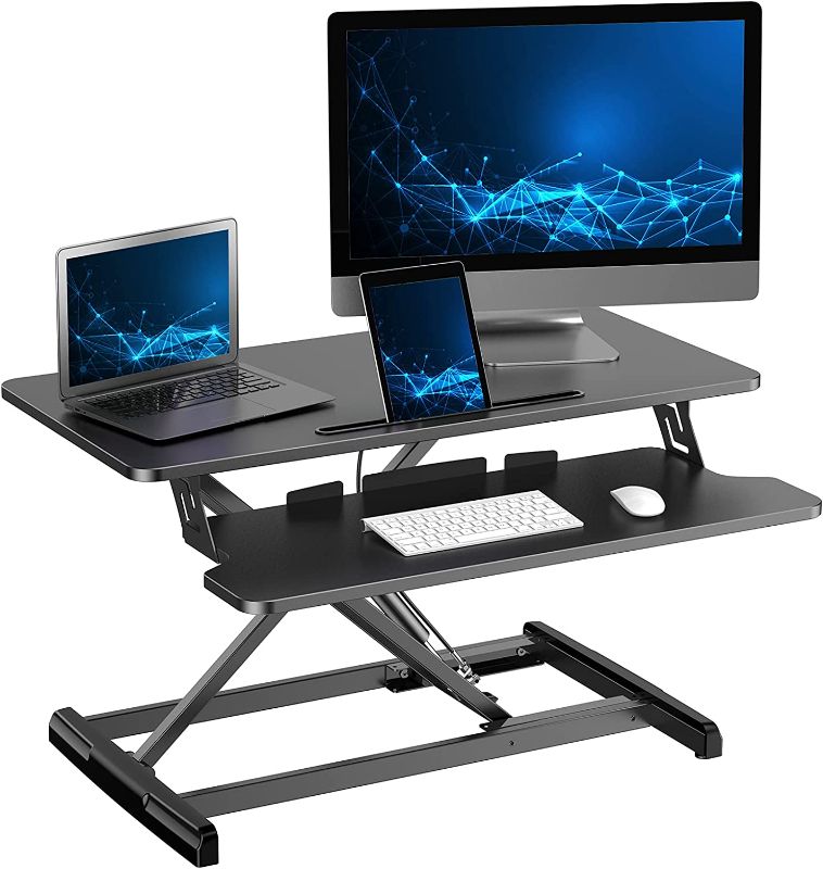 Photo 1 of ATUMTEK Standing Desk Converter, 32 Inch Height Adjustable Sit to Stand Desk Riser, Home Office Dual Monitor and Laptop Tabletop Workstation with Wide Keyboard Tray, Black