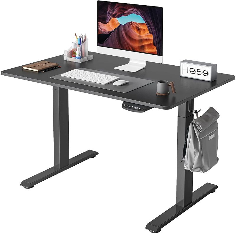 Photo 1 of FEZIBO Height Adjustable Electric Standing Desk, 55 x 24 Inches Stand up Table, Sit Stand Home Office Desk with Splice Board, Black Frame/Black Top
