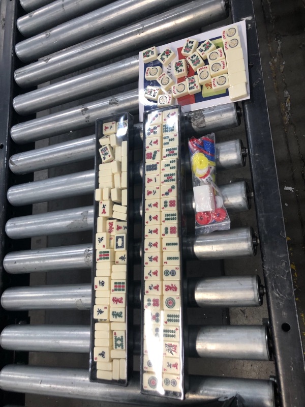 Photo 5 of *loose components*
American Mah Jong Set - 166 Ivory Colored Engraved Tiles, 4 x Combo Rack/Pushers - Black Aluminum Case

