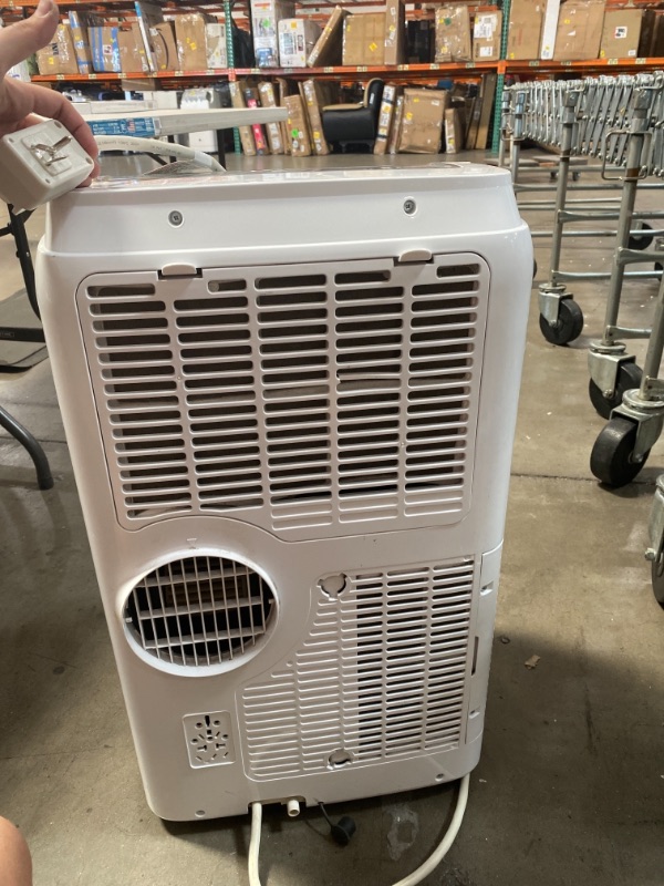 Photo 4 of BLACK+DECKER Portable Air Conditioner with Remote Control, 12,000 BTU, Cools Up to 300 Square Feet, White, BPACT12WT AS IS USED, MINOR DAMAGE, PLEASE SEE PHOTOS, DIFFICULTY MOVING, UNABLE TO TEST 
