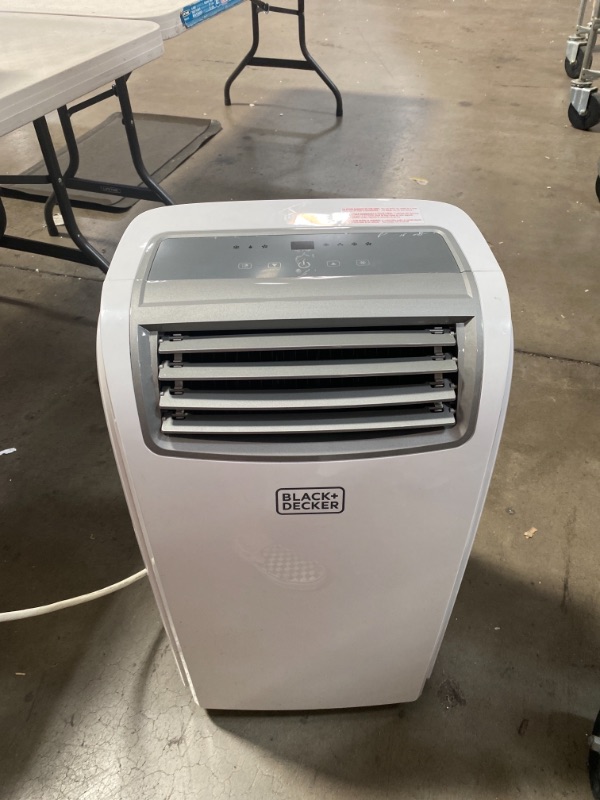 Photo 2 of BLACK+DECKER Portable Air Conditioner with Remote Control, 12,000 BTU, Cools Up to 300 Square Feet, White, BPACT12WT AS IS USED, MINOR DAMAGE, PLEASE SEE PHOTOS, DIFFICULTY MOVING, UNABLE TO TEST 
