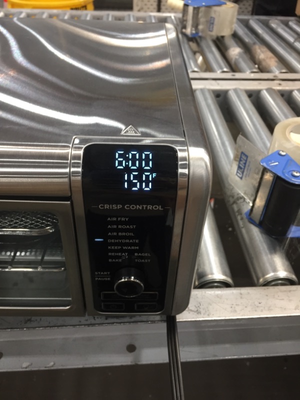 Photo 2 of **DAMAGED**
NINJA Foodi SP101/FT102CO Digital Fry, Convection Oven, Toaster, Air Fryer, Flip-Away for Storage, with XL Capacity, and a Stainless Steel Finish
