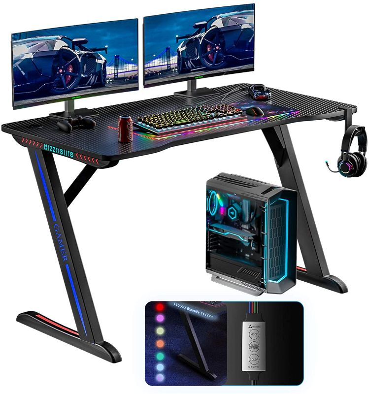 Photo 1 of Bizzoelife Ergonomic Gaming Desk, 47Inch Z Shaped Home Office PC Computer Table, Gamer Workstation with RGB LED Lights, Racing Style Game Tables with Headphone Hook & 2 Cable Management Holes
