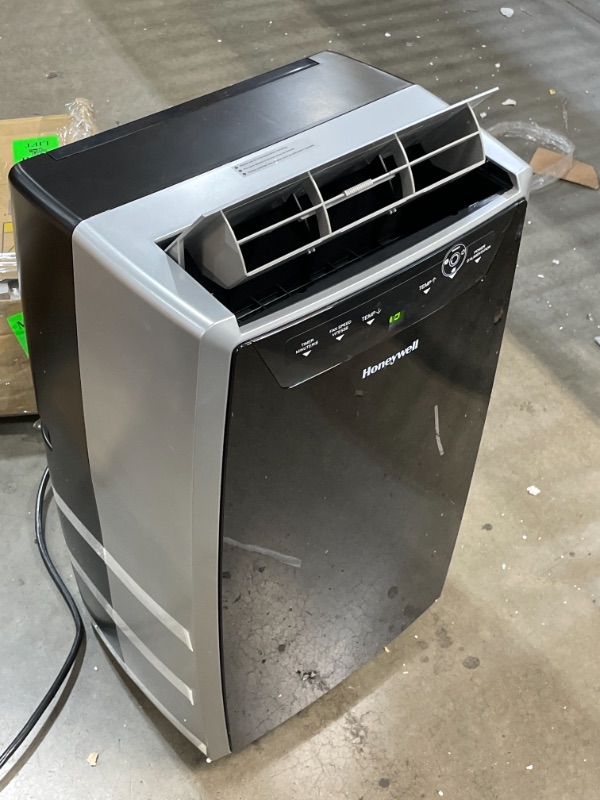 Photo 1 of Honeywell Classic Portable Air Conditioner with Dehumidifier & Fan Cools Rooms Up To 500 Sq. Ft. w Drain Pan & Insulation Tape, (Black/Silver) MN1CFS8, 29.400
