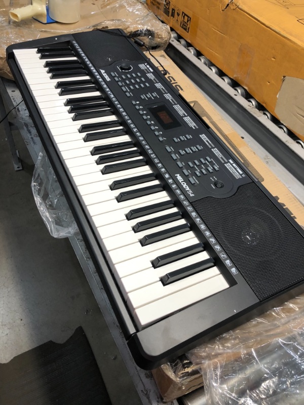 Photo 2 of Alesis Melody 54 - Electric Keyboard Digital Piano with 54 Keys, Speakers, 300 Sounds, 300 Rhythms, 40 Songs, Microphone and Piano Lessons
