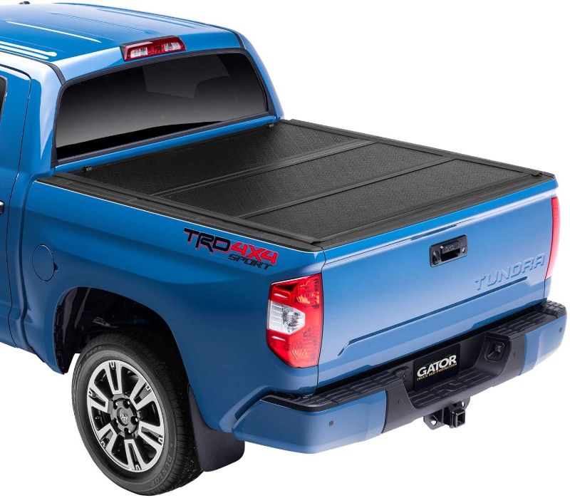 Photo 1 of *SEE last picture for damage*
Gator EFX Hard Tri-Fold Truck Bed Tonneau Cover | GC44008 | Fits 2007 - 2021 Toyota Tundra w/cargo management system, will not work w/ Trail Edition models 5' 7" Bed (66.7")
