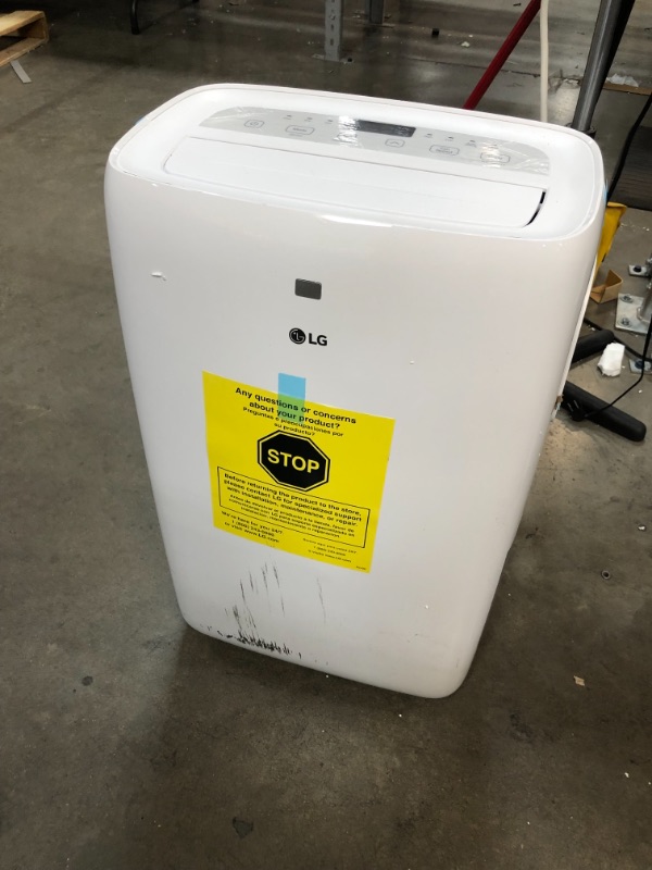 Photo 2 of *SEE last picture for damage*
LG 6,000 BTU (DOE) / 8,000 BTU (ASHRAE) Portable Air Conditioner, Cools 250 Sq.Ft. (10' x 25' room size), Quiet Operation, LCD Remote, Window Installation Kit Included, 115V
