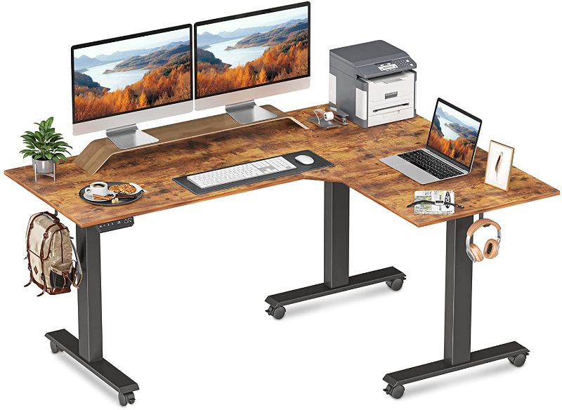 Photo 1 of FEZIBO Triple Motor L-Shaped Electric Standing Desk, 63 inches Height Adjustable Stand up Corner Desk, Sit Stand Workstation with Splice Board, Black...
