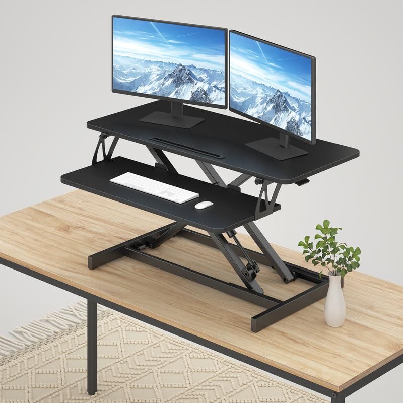 Photo 1 of FEZIBO Standing Desk Converter...**PREVIOUSLY OPENED**
