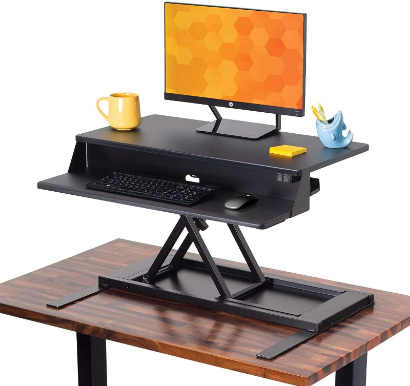 Photo 1 of Flexpro Power 32 Inch Electric Standing Desk - Electric Height-Adjustable Stand up Desk by Award Winning Stand Steady - Holds 2 Monitors - Easy Quiet Adjustments (Black) (32") MODEL IN STOCK PHOTO MAY BE SLIGHTLY DIFFERENT - SAME BRAND. 
